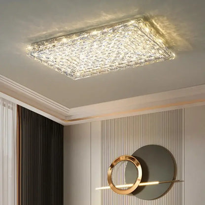 Modern square crystal led ceiling light with silver and chrome finish featuring a faceted design and warm glow