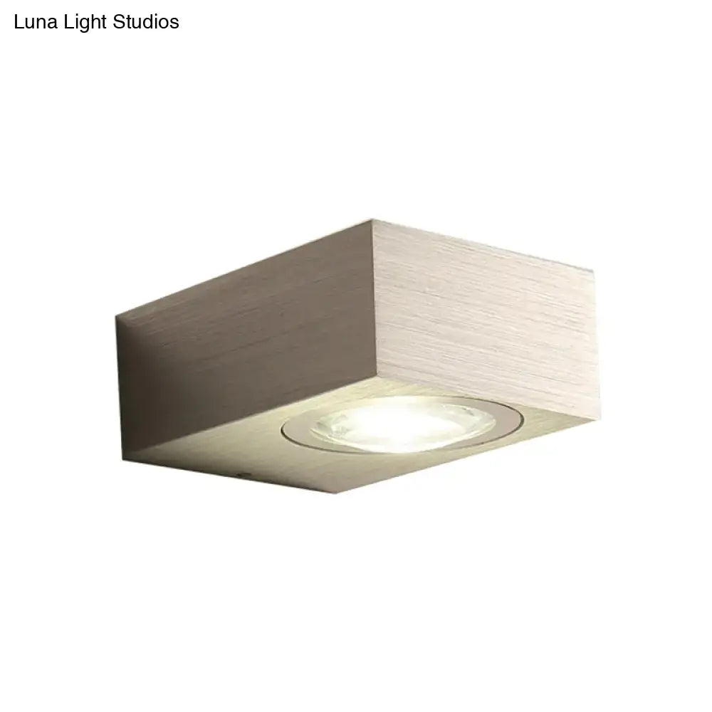 Modern square led bedroom wall light in black silver with brushed metallic finish and recessed circular bulb