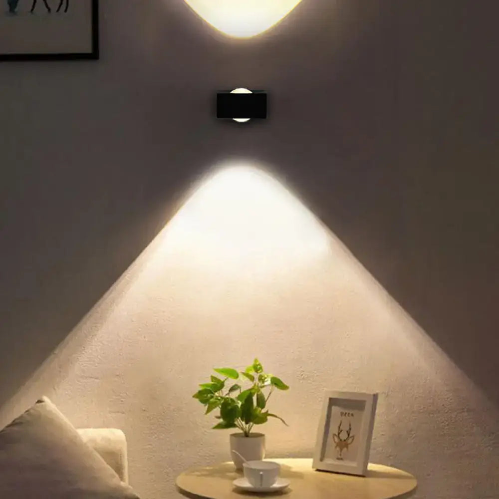 Modern square led black silver bedroom wall light with rectangular design casting warm focused illumination