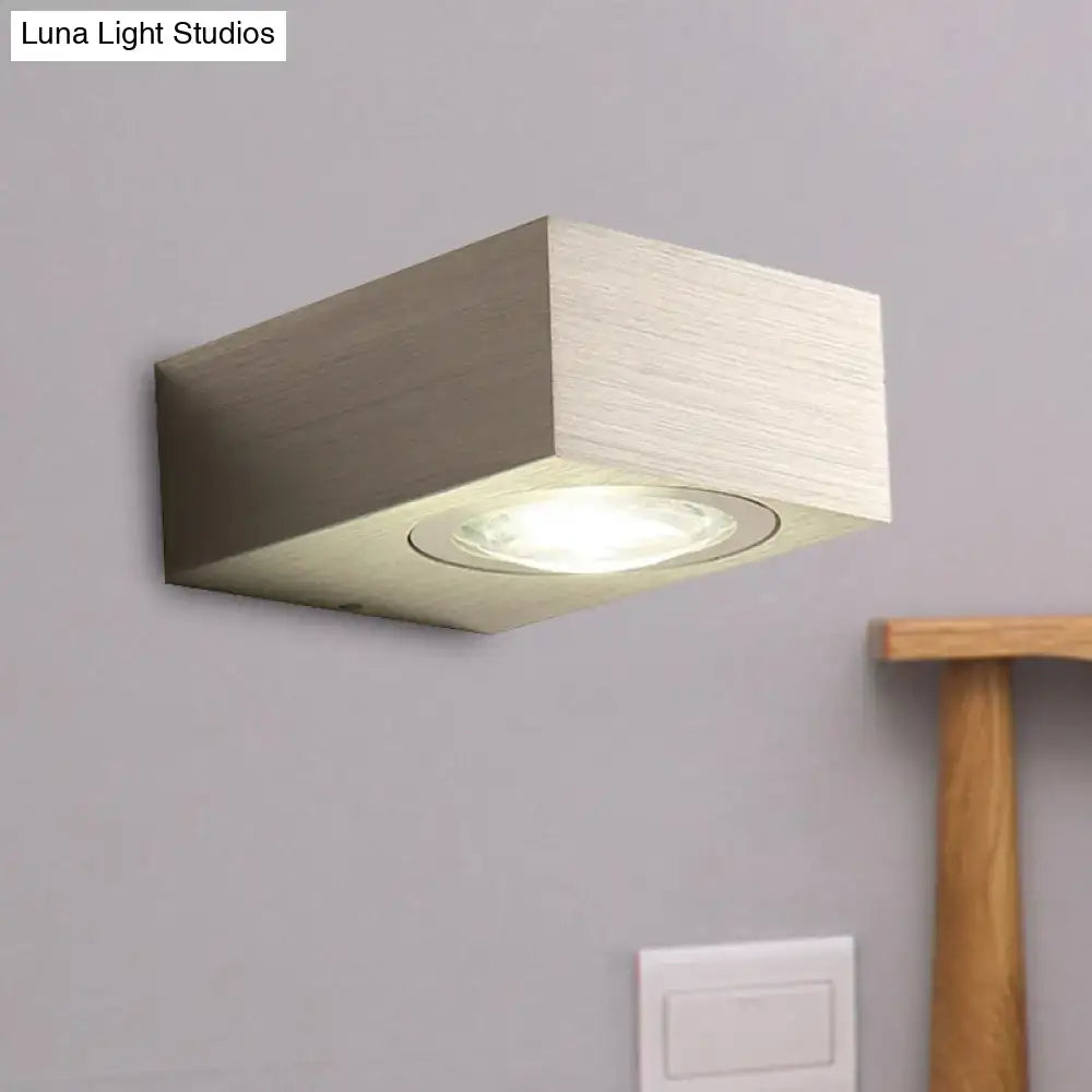Modern rectangular bedroom wall light with black silver brushed metallic finish and recessed circular led light