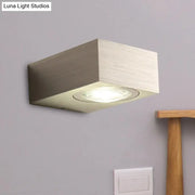 Modern rectangular bedroom wall light with black silver brushed metallic finish and recessed circular led light