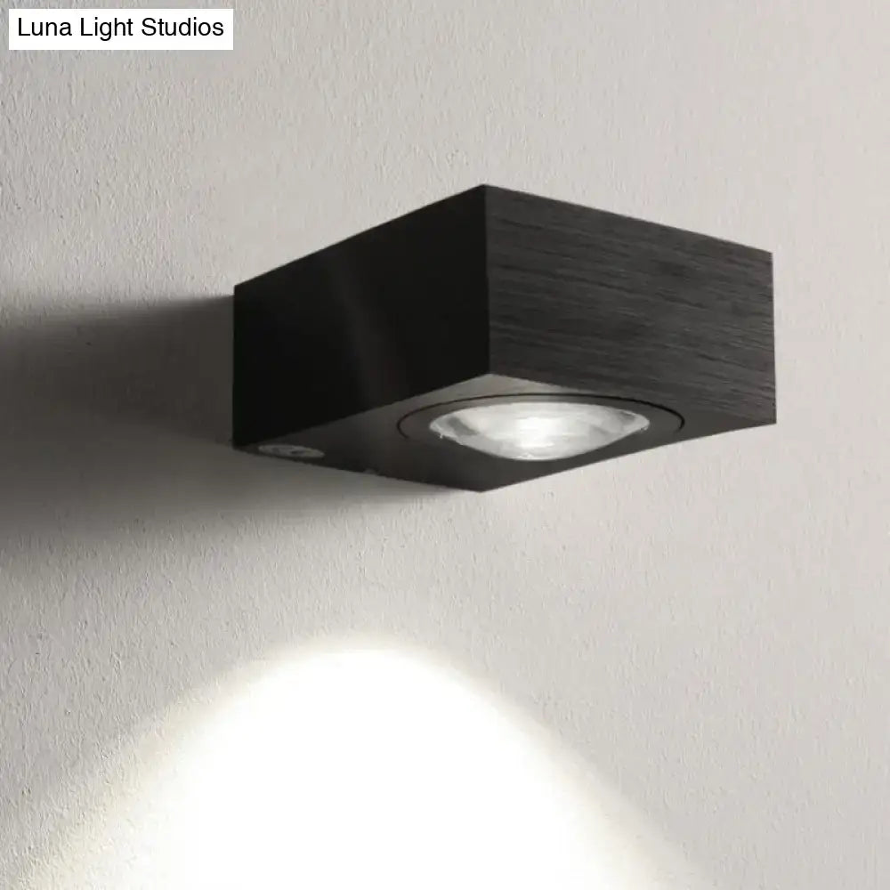 Black and silver modern square led wall light with matte wood-grain finish and adjustable spotlight for bedroom wall use