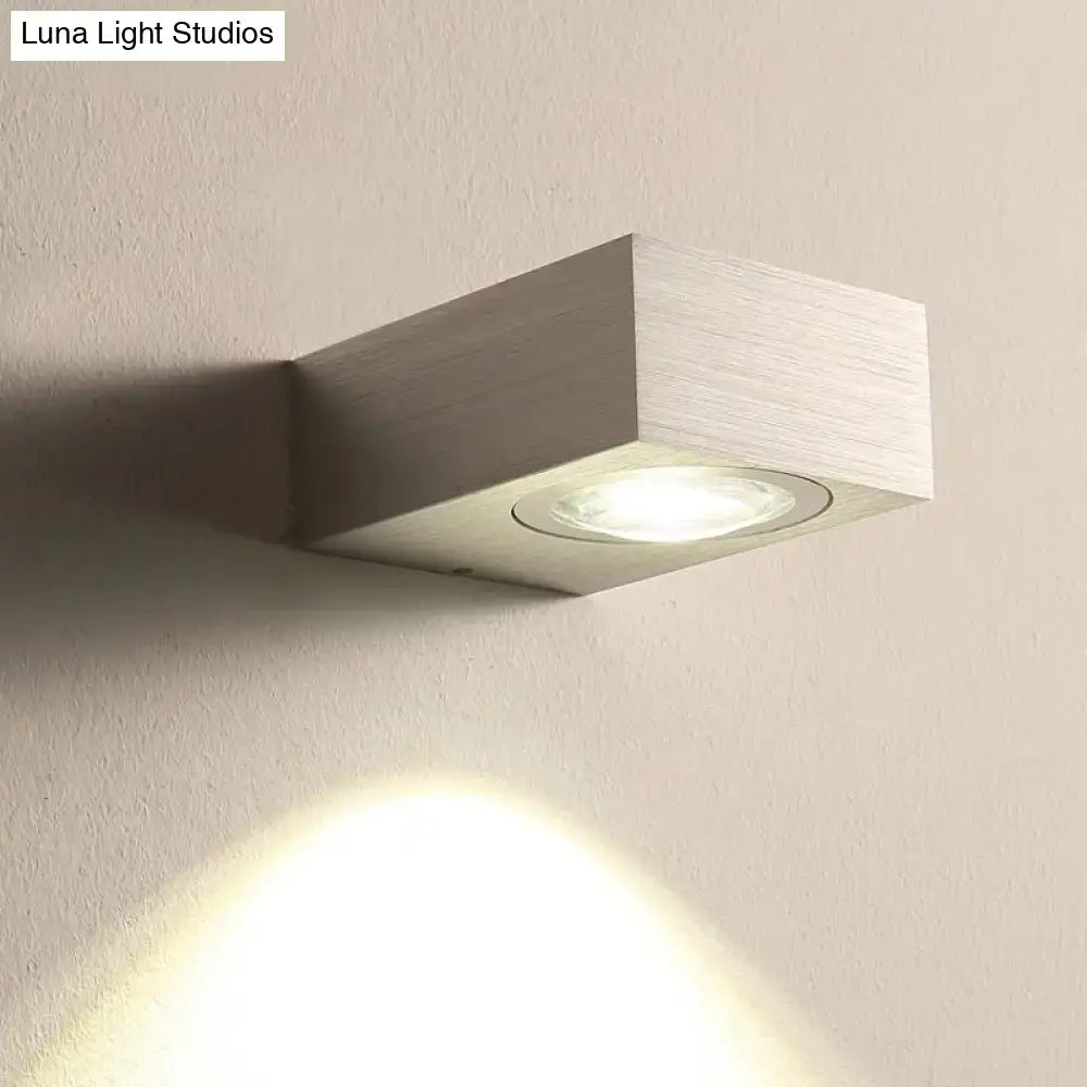 Modern brushed silver rectangular wall light with recessed circular fixture for black silver bedroom wall use