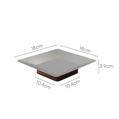 Modern square fruit bowl tray featuring a matte white ceramic top and dark wood base for living room use