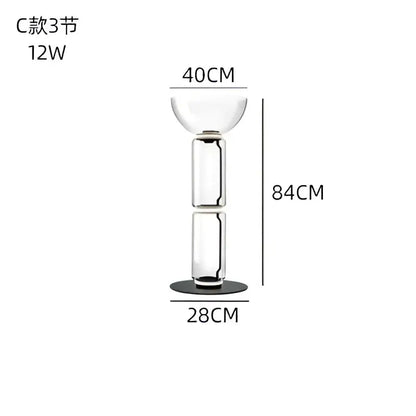 Modern stacked clear glass led floor lamp with three sections and a black base for living room lighting