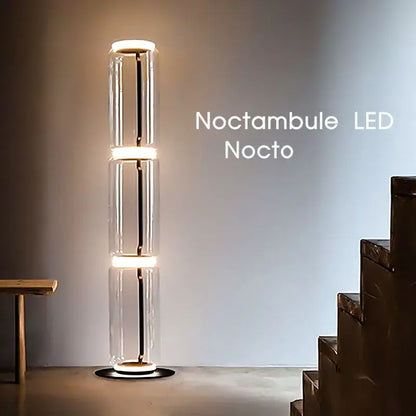 The noctambule led nocto floor lamp features a modern glass led floor design with warm white stacked cylindrical sections