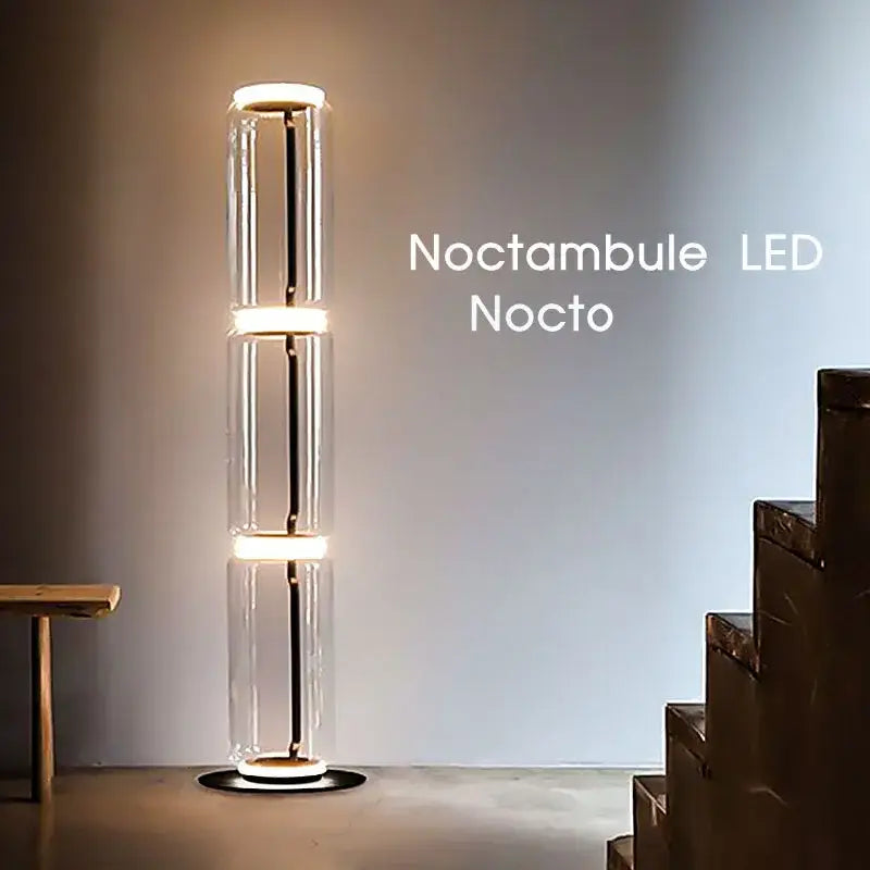 The noctambule led nocto floor lamp features a modern glass led floor design with warm white stacked cylindrical sections