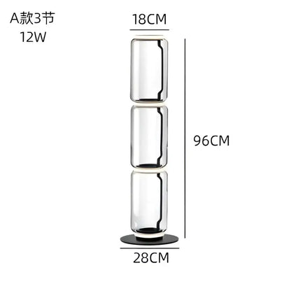 Modern stacked glass led floor lamp with three cylindrical sections and black base for elegant living room lighting