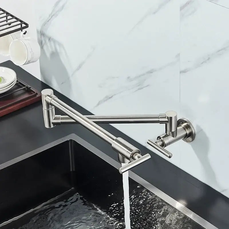 Modern stainless steel double joint spout kitchen faucet with a sleek design and dual handles by decorbites