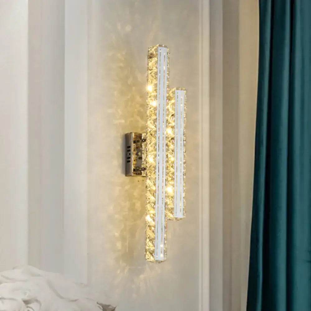 Modern stainless steel k9 crystal led wall mount light with two vertical bars emitting warm light for living room