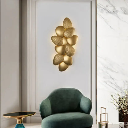 Modern gold textured stainless steel squama wall light featuring a cluster design for bedroom use