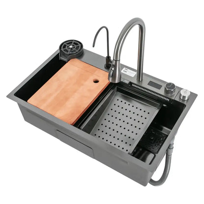 Modern stainless steel waterfall kitchen sink in gray with pull out faucet, built-in wooden cutting board, and drain basket