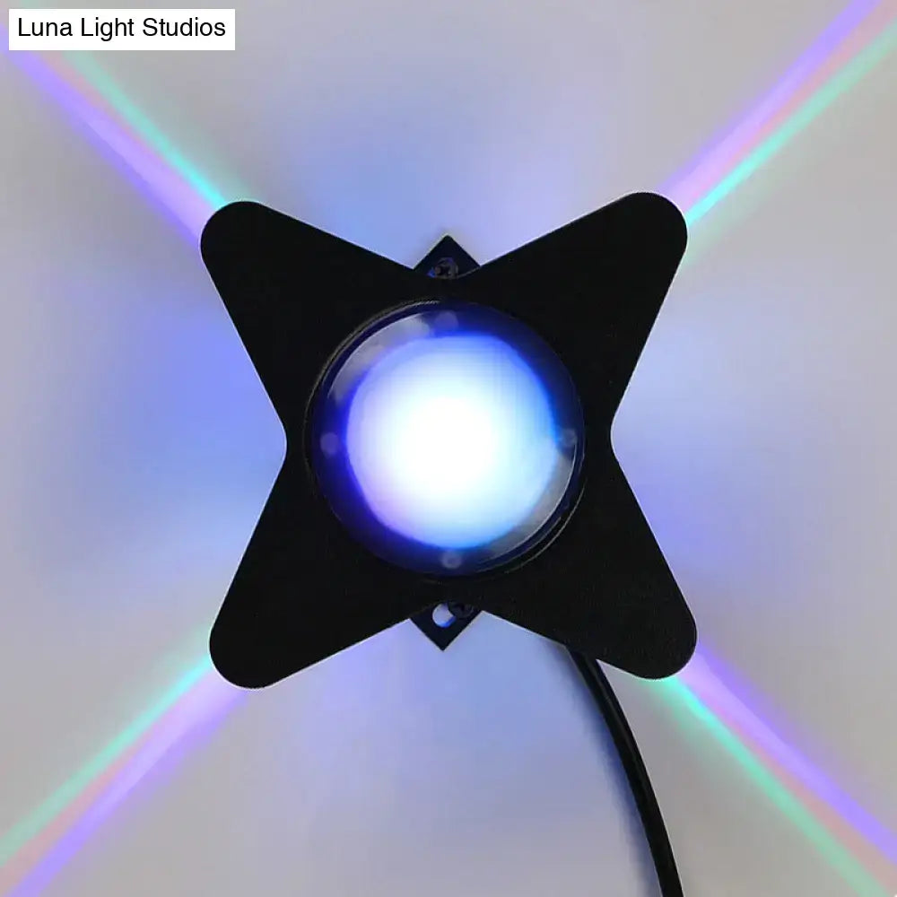 Modern black star-shaped petals outdoor wall led light with blue bulb emitting colorful rainbow beams for garden use