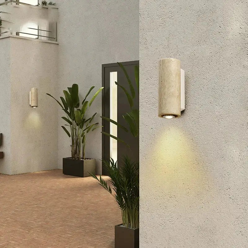Beige concrete-textured cylindrical wall lamp with sleek white bracket for decorbites cave stone outdoor lighting
