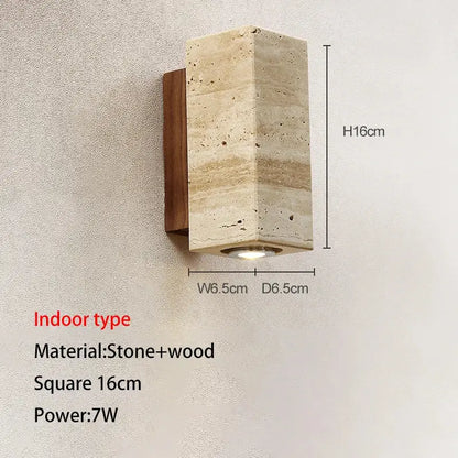 A modern wall lamp with a recessed led light crafted from beige stone and dark wood for decorbites cave stone outdoor use