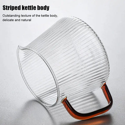 Modern striped glass coffee pot with vertical ribbed texture and curved amber handle for stylish kitchen use