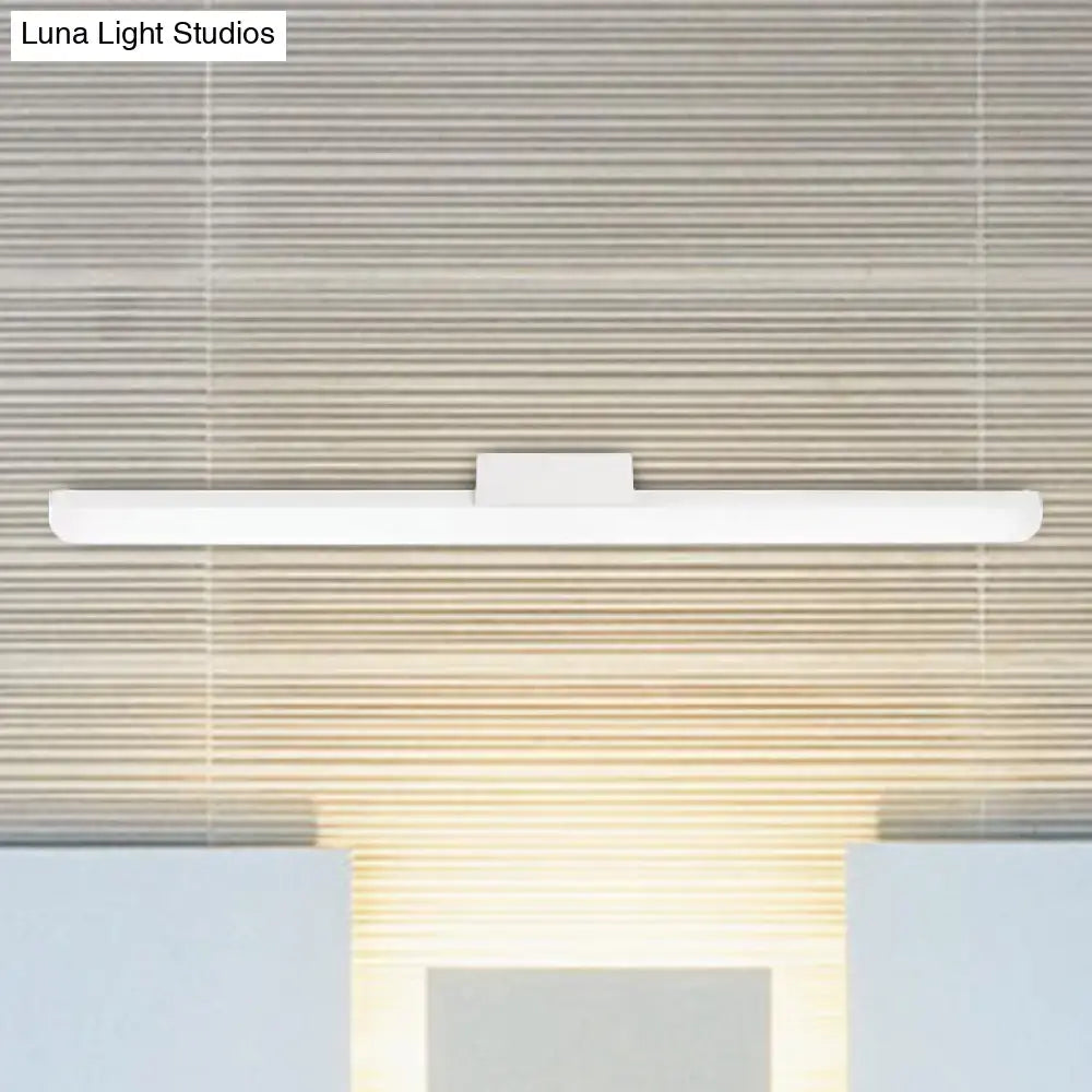 A sleek modern style white led wall light with minimalist rectangular design for bedroom linear sconce use
