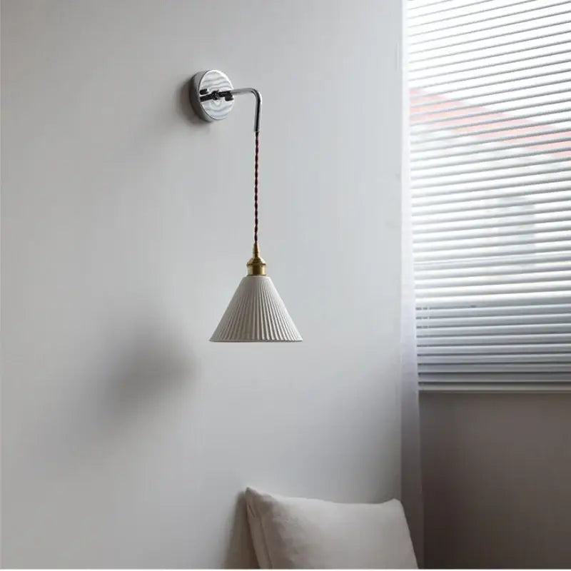 White ceramic led wall sconce with fluted conical shade and brass accents for modern bedroom decorbites ceramic led design