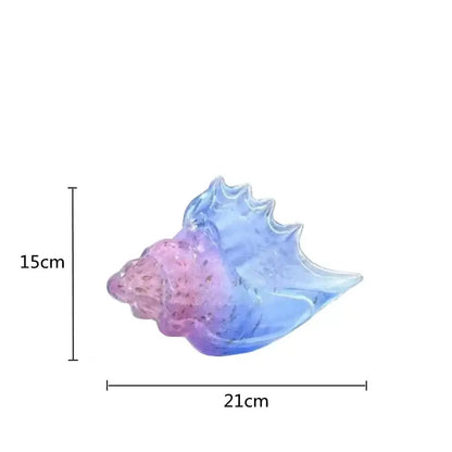 Modern teal and amber glass conch shell statue with translucent pink to blue gradient scalloped edges for living room decor