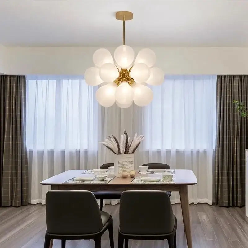 Modern teal and brass decorbites glass bubble chandelier pendant light with gold fixture and frosted glass globes for living room decor