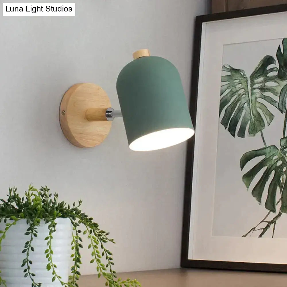 Modern teal and wood wall lamp with matte finish and wooden base ideal as a bedroom sconce