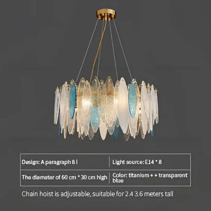Modern teal and gold glass chandelier light with translucent blue and clear leaf-shaped panels for living room use