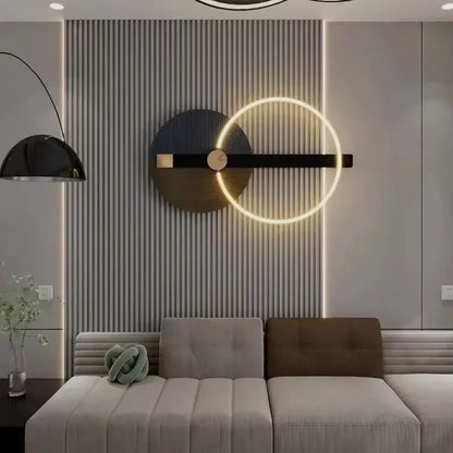 Modern teal and gold led wall sconce with a glowing gold ring and black matte colorful metal accents for bedroom use