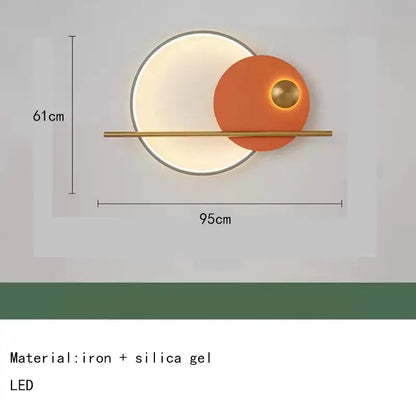 Modern teal and gold led wall sconce with colorful metal circular design featuring orange illuminated disc for bedroom use