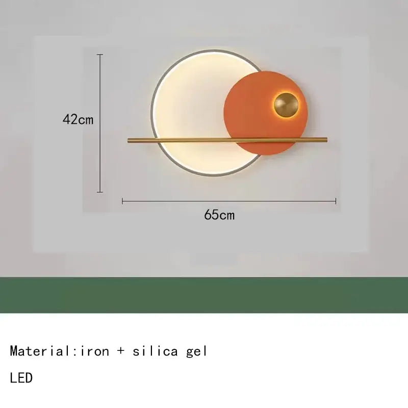 Modern teal and gold led wall sconce with colorful metal brass elements and glowing circular design for bedroom use