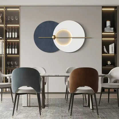 Modern teal and gold led wall sconce featuring colorful metal circular wall art with navy blue and white discs and brass rod accent