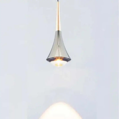 Modern teardrop pendant light with metallic gold stem and chrome conical shade warm cord pendant light for dining room