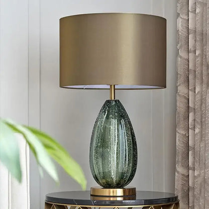 Elegant teal green glass table lamp with gold finished base and drum shade perfect for bedroom decorbites glass table lamp