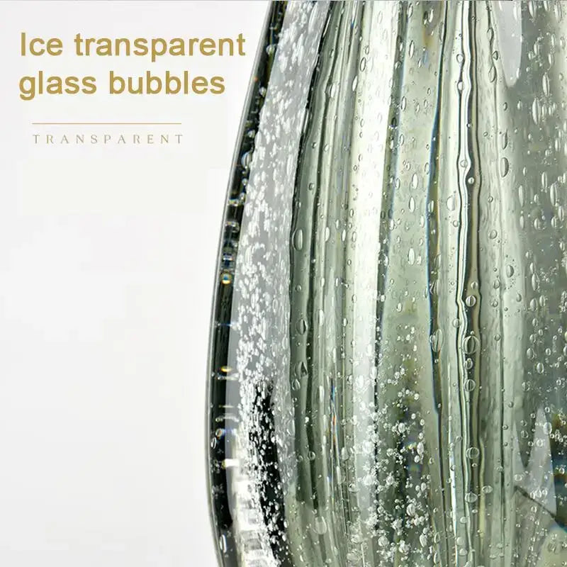 Modern green and gold glass table lamp with a transparent ribbed vase featuring embedded ice-like bubbles for decorbites glass table lamp