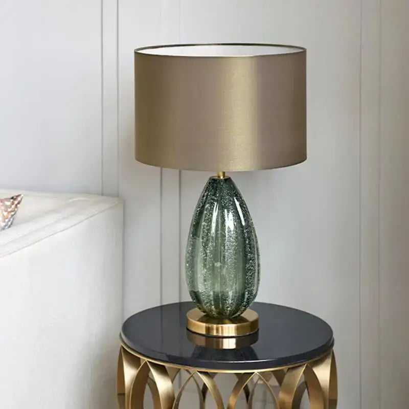 Modern teardrop textured teal green glass table lamp with gold finished base and drum shade for bedroom decorbites glass table lamp