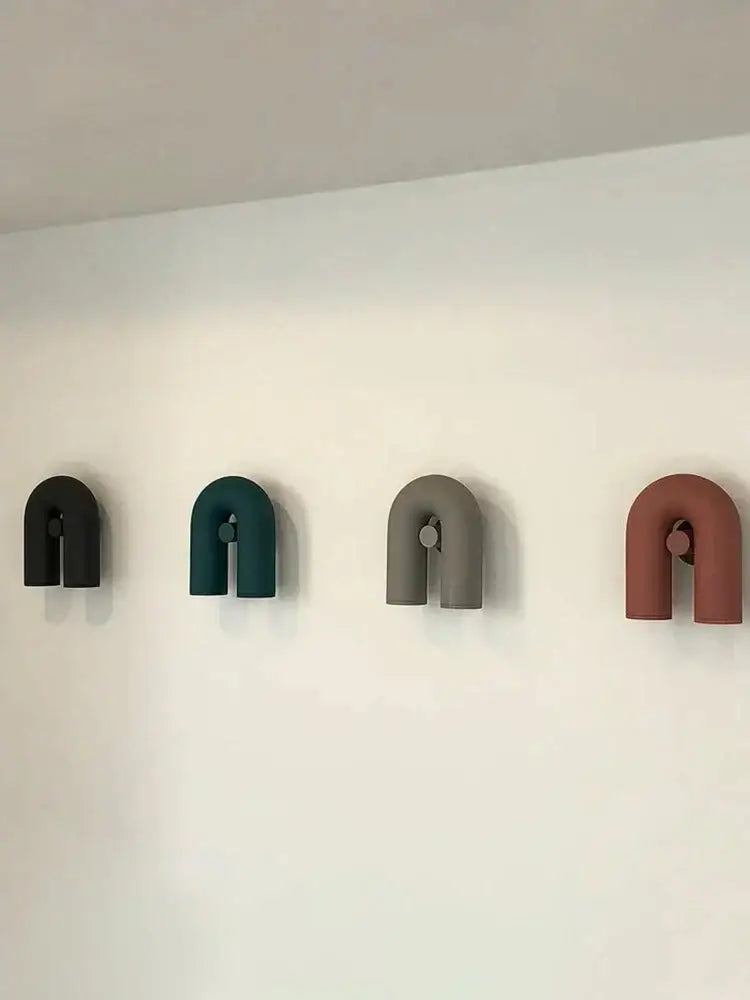 Modern terracotta led u-shaped wall lamp with matte black, teal, gray, and terracotta hooks for living room staircase