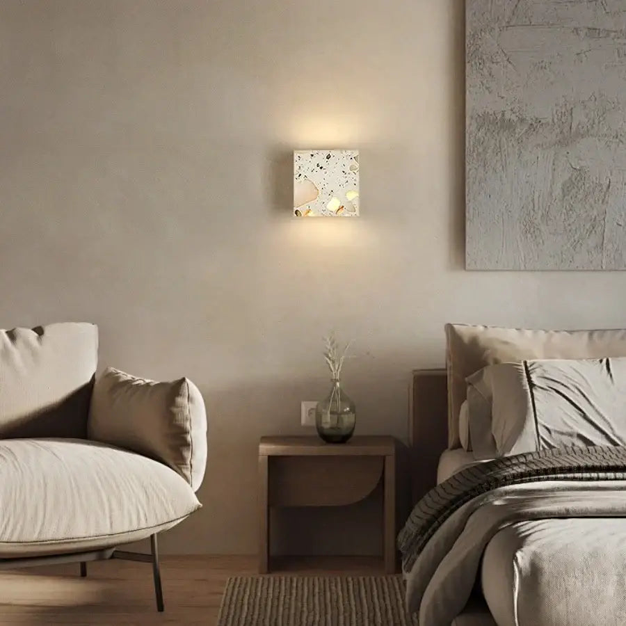 Square terrazzo cube led wall light fixture with speckled white and beige surface modern decorbites led wall sconce