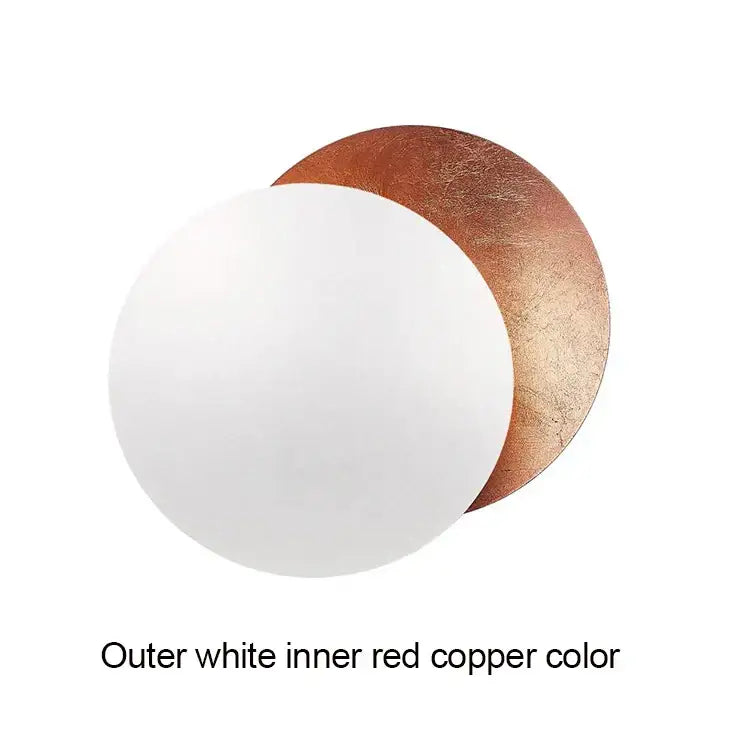 Modern textured eclipse round wall lamp in white and copper with a smooth, slightly textured surface for bedroom use