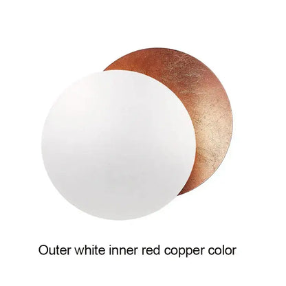 Modern textured eclipse round wall lamp in white and copper with a smooth, slightly textured surface for bedroom use