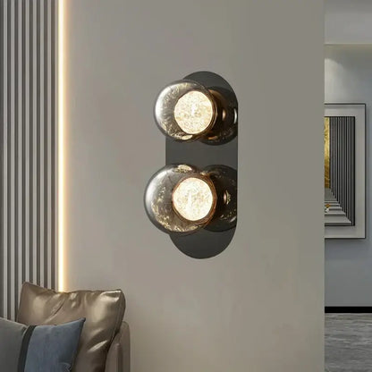 Modern double-bulb sconce lamp with frosted glass ball globes and black metal backplate for bedroom decorbites glass ball decor