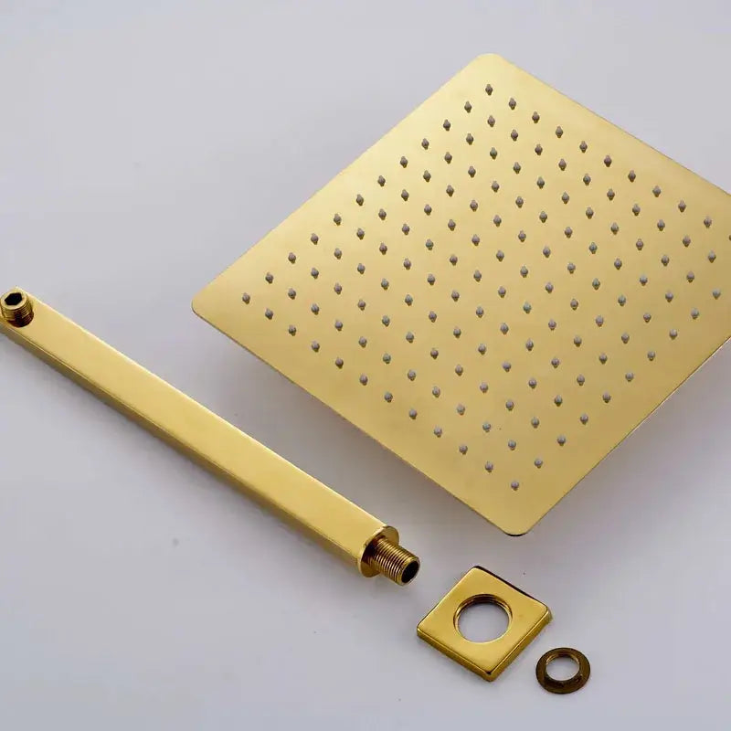 Modern textured gold rain shower set with gold-finished square showerhead and matching brass wall-mounted fixtures