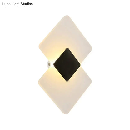 Modern textured silver and black direct wired electric wall sconce with diamond-shaped frosted acrylic panels
