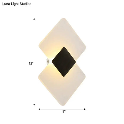 Modern textured silver and black direct wired electric wall sconce with diamond-shaped frosted white and black panels