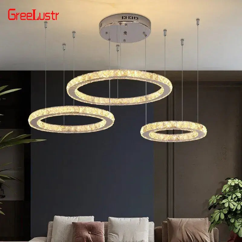 Modern three tier chrome decorbites crystal led chandelier with crystal-encrusted rings and warm ambient lighting