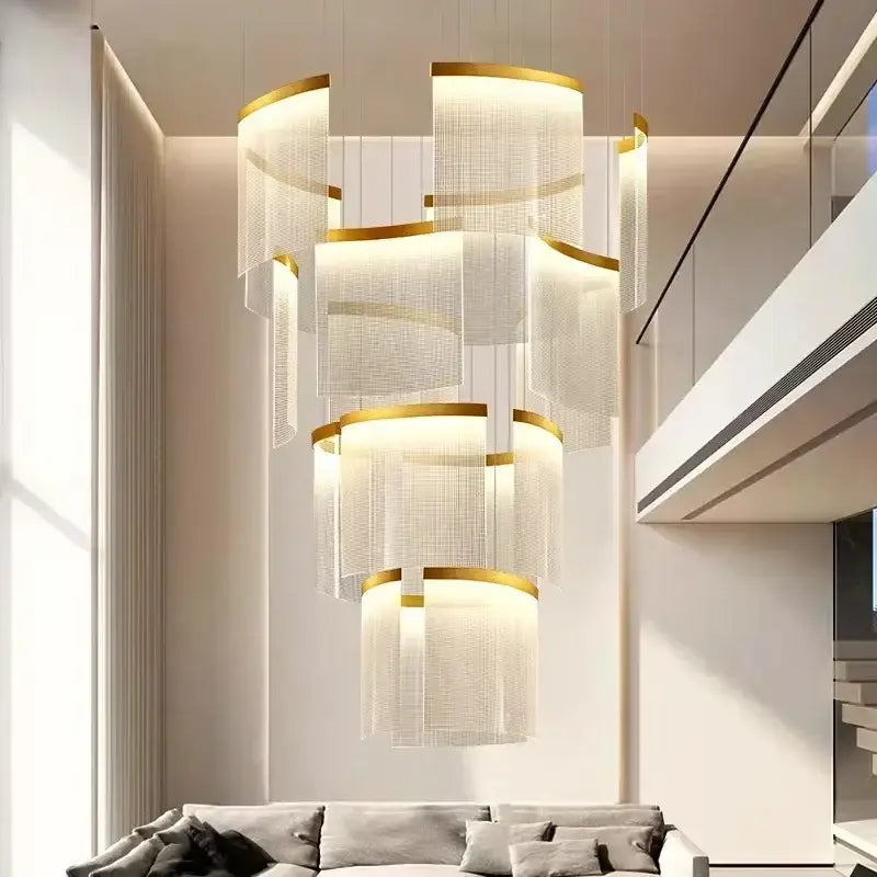 A modern tiered gold led ceiling chandelier with translucent mesh shades for elegant dining room lighting