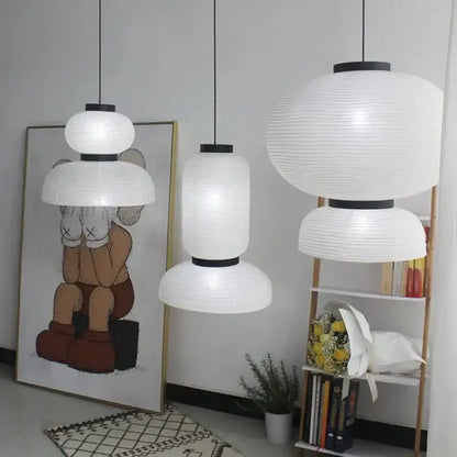 Three white ribbed paper pendant lights with black metal tops for dining room decorbites designer led modern tiered style