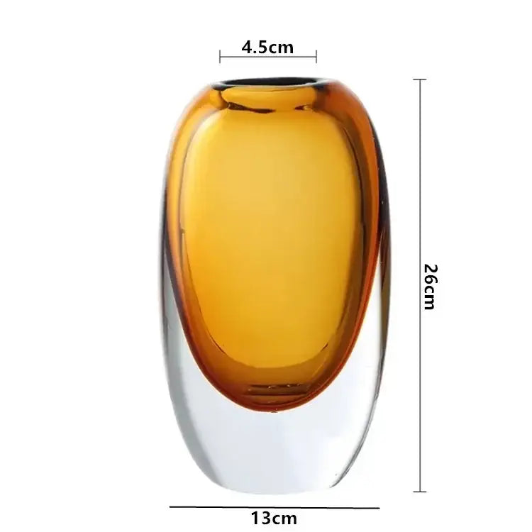 A sleek amber crystal glass flower vase with smooth oval shape and transparent base for modern decorbites decor