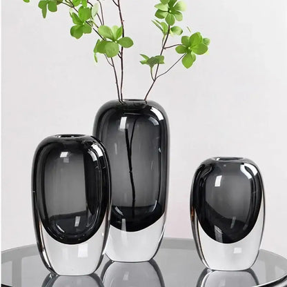 Set of three modern translucent black crystal glass flower vases with sleek glossy decorbites crystal glass design