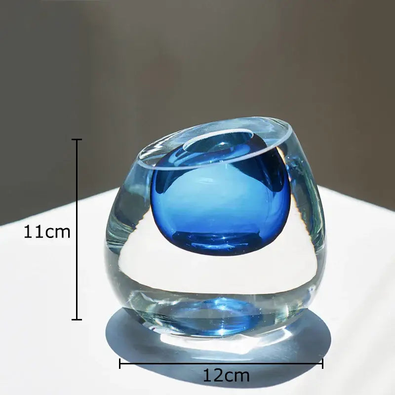Modern translucent blue colorful glass vase with rounded asymmetrical design and smooth glossy finish flower pot decorbites