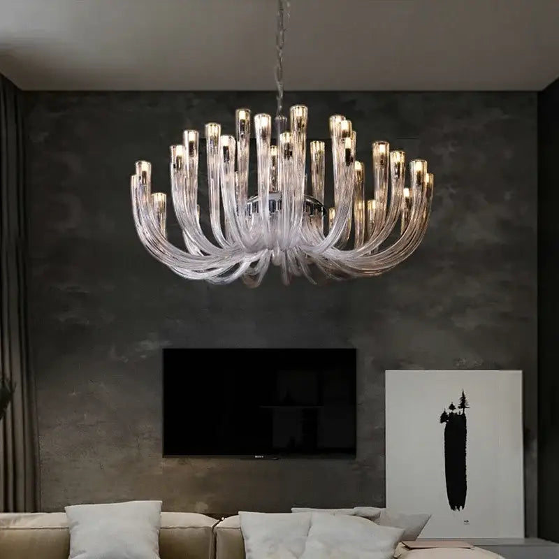 Modern transparent glass chandelier led hanging light with multiple curved arms and warm-toned lights for dining room