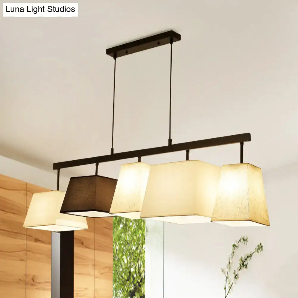 Modern black metal hanging lamp with four cream and brown fabric trapezoid shades for island light or ceiling light use